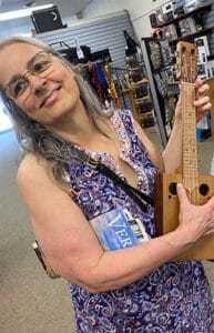 Cat playing a ukulele at a store in Vermont